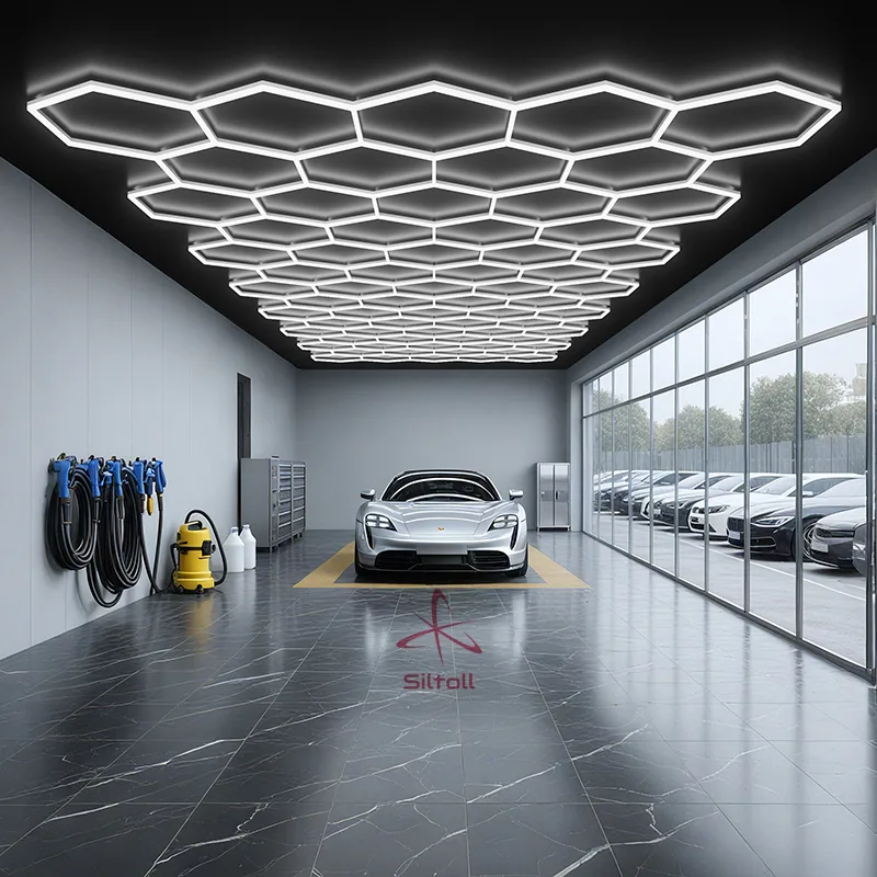 Hexagon LED car detailing lights installed on garage ceiling, providing bright and uniform lighting for professional car care