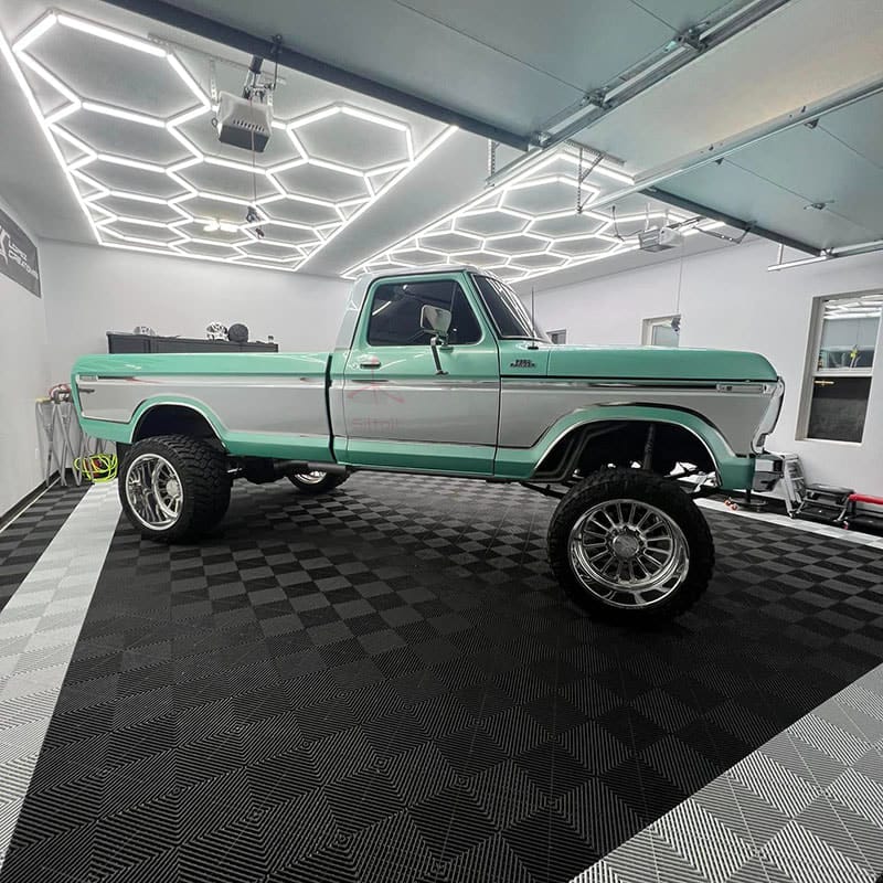Siltoll modular hexagon LED lighting system installed in professional car detailing studio